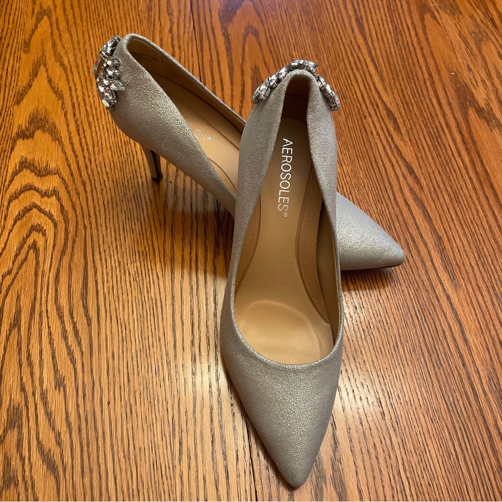 New in box! Silver Heels with Rhinestone detail.